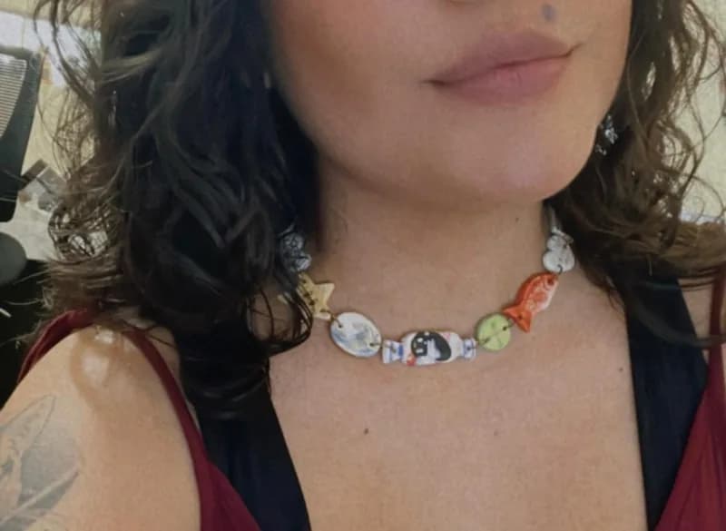 Wearing handmade ceramic bead necklace